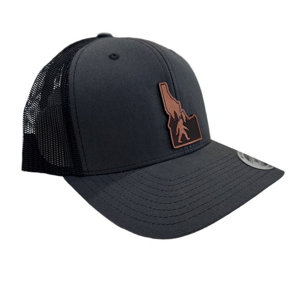 Idaho Yeti Leather Patch on a Charcoal and Black Adjustable Trucker Hat