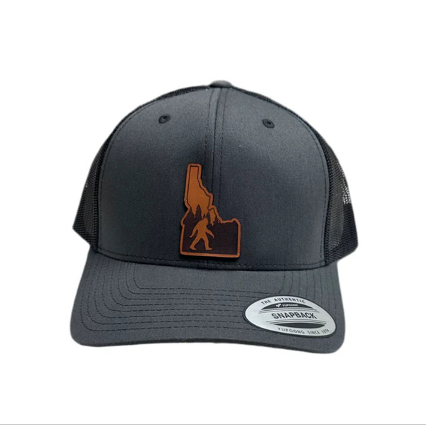 Idaho Yeti Leather Patch on a Charcoal and Black Adjustable Trucker Hat