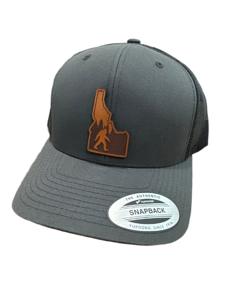 Idaho Yeti Leather Patch on a Charcoal and Black Adjustable Trucker Hat