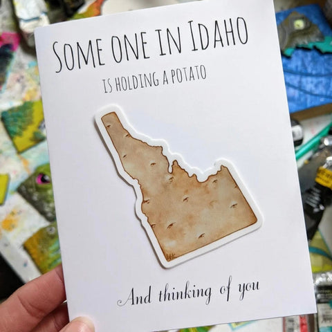 Lauren T Kistner Arts Card + Sticker "Someone in Idaho is holding a potato and thinking of you"
