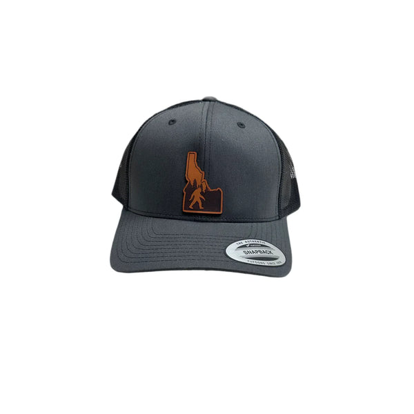Idaho Yeti Leather Patch on a Charcoal and Black Adjustable Trucker Hat